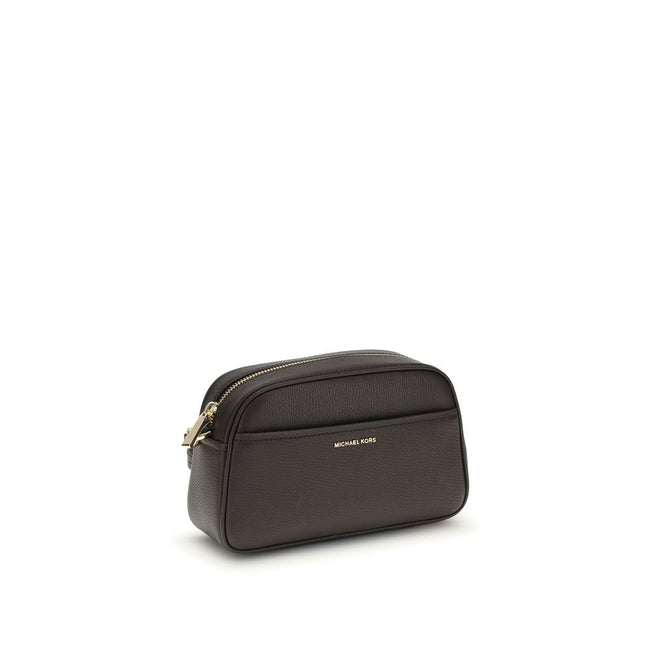 Jet Set BagThe Jet Set Bag by Michael Kors features a functional and elegant design, with a convenient open front pocket and a secure zip closure. The shoulder strap is removable and adjustable, with gold-tone metal details that add a refined touch. Insid