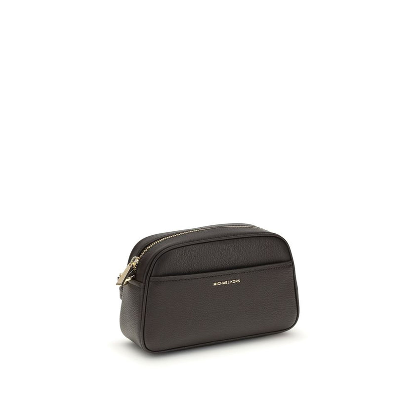 Jet Set BagThe Jet Set Bag by Michael Kors features a functional and elegant design, with a convenient open front pocket and a secure zip closure. The shoulder strap is removable and adjustable, with gold-tone metal details that add a refined touch. Insid