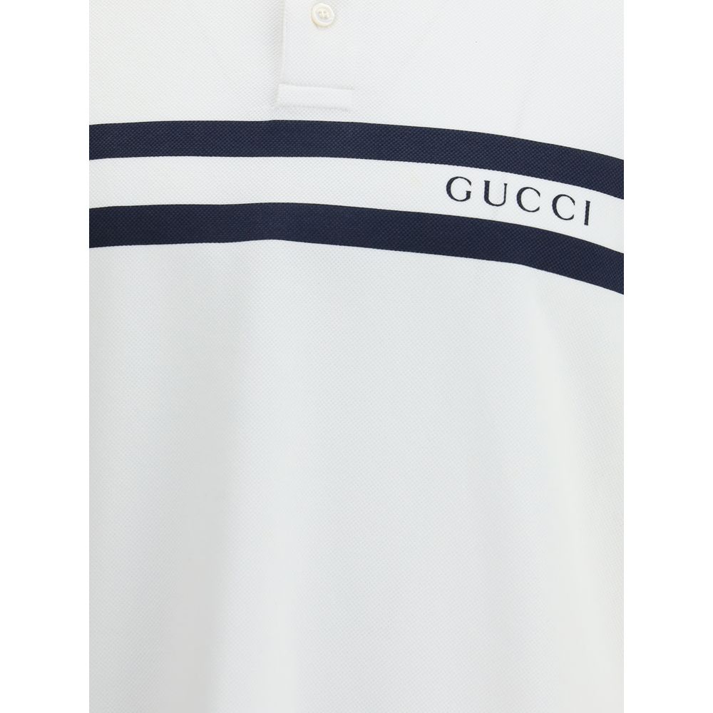 White Cotton Polo ShirtThe white stretch Cotton Polo Shirt by Gucci, with a relaxed and comfortable fit, is enhanced by a striped print and the Gucci logo centered on the front, for a modern and distinctive look. Season: AW25 Fit: Regular Composition: 95%