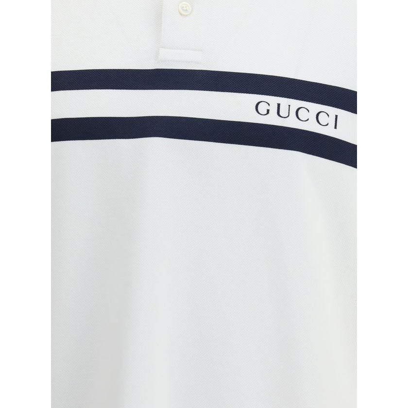White Cotton Polo ShirtThe white stretch Cotton Polo Shirt by Gucci, with a relaxed and comfortable fit, is enhanced by a striped print and the Gucci logo centered on the front, for a modern and distinctive look. Season: AW25 Fit: Regular Composition: 95%
