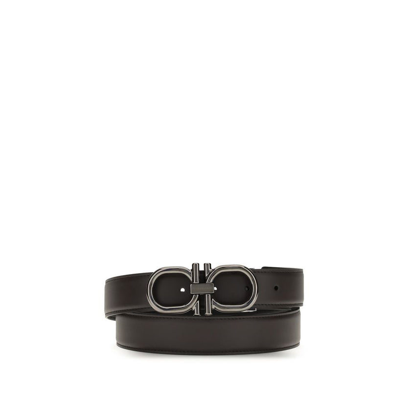 Brown Calf Leather Bos Taurus Regular BeltFerragamo’s Gancini Belt is a reversible, adjustable model designed for versatile elegance. The stitched rod lends a casual touch, while the ruthenium-finish buckle, with stylized double Gancini, adds character an