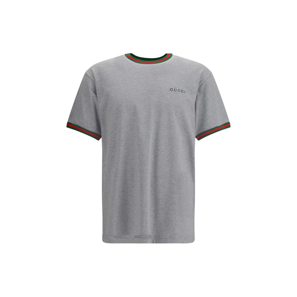 Gray Cotton T-ShirtLight grey melange cotton T-shirt with Gucci embroidery on the chest and contrasting Web details. Season: AW25 Fit: Regular Composition: 100% Cotton MADE IN ITALYGray Cotton T-Shirt${tagsGucciAulae Cotton T-shirt with embroidered logo G