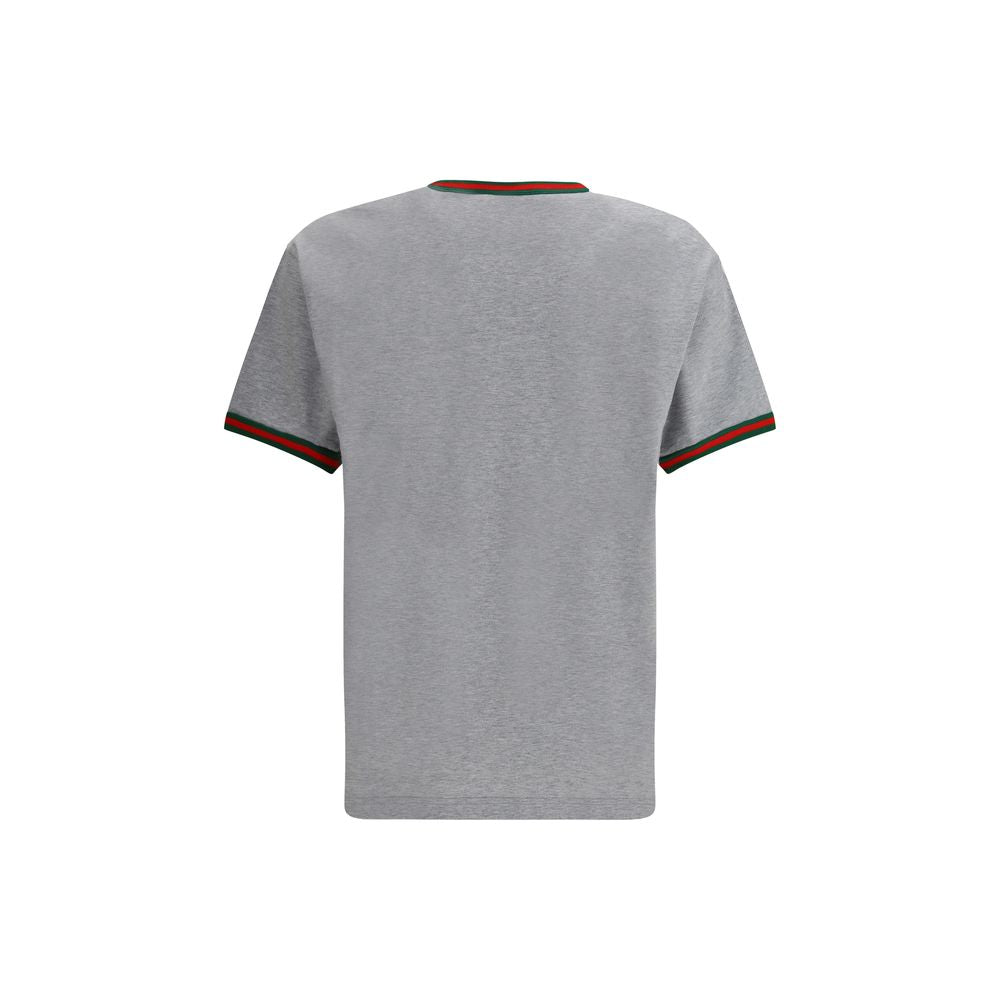 Gray Cotton T-ShirtLight grey melange cotton T-shirt with Gucci embroidery on the chest and contrasting Web details. Season: AW25 Fit: Regular Composition: 100% Cotton MADE IN ITALYGray Cotton T-Shirt${tagsGucciAulae Cotton T-shirt with embroidered logo G