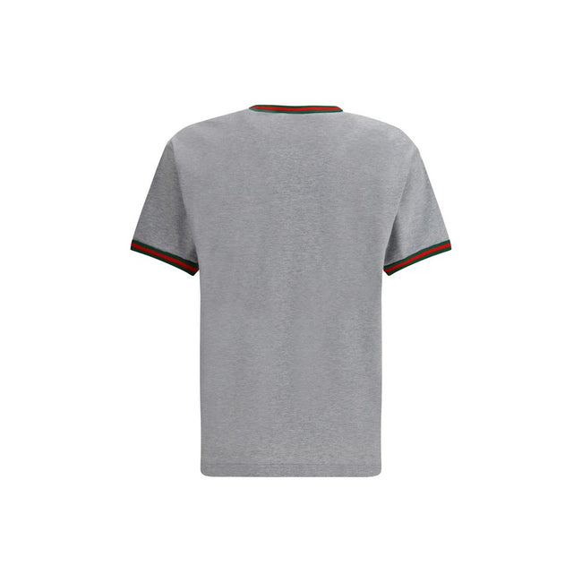 Gray Cotton T-ShirtLight grey melange cotton T-shirt with Gucci embroidery on the chest and contrasting Web details. Season: AW25 Fit: Regular Composition: 100% Cotton MADE IN ITALYGray Cotton T-Shirt${tagsGucciAulae Cotton T-shirt with embroidered logo G