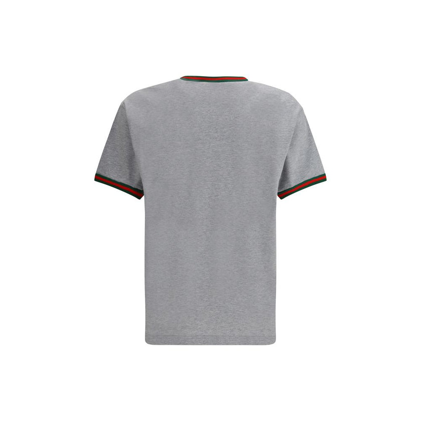 Gray Cotton T-ShirtLight grey melange cotton T-shirt with Gucci embroidery on the chest and contrasting Web details. Season: AW25 Fit: Regular Composition: 100% Cotton MADE IN ITALYGray Cotton T-Shirt${tagsGucciAulae Cotton T-shirt with embroidered logo G