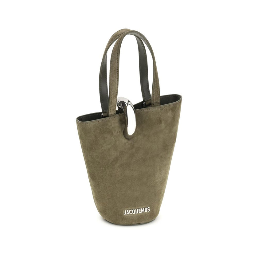 La Bambola Bucket BagThe La Bambola Bucket Bag by Jacquemus combines original design and functionality. Made from soft suede leather, it features double handles and a removable shoulder strap for versatile carrying options. The silver-tone metal ring clos