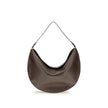 Brown Calf Leather Bos Taurus Shoulder BagThe Ovalo Bag by Jacquemus is an elegant large hobo bag crafted from smooth leather, featuring a slim shoulder strap for easy carrying. The flap with a large engraved snap button ensures secure closure, while the