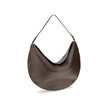 Brown Calf Leather Bos Taurus Shoulder BagThe Ovalo Bag by Jacquemus is an elegant large hobo bag crafted from smooth leather, featuring a slim shoulder strap for easy carrying. The flap with a large engraved snap button ensures secure closure, while the