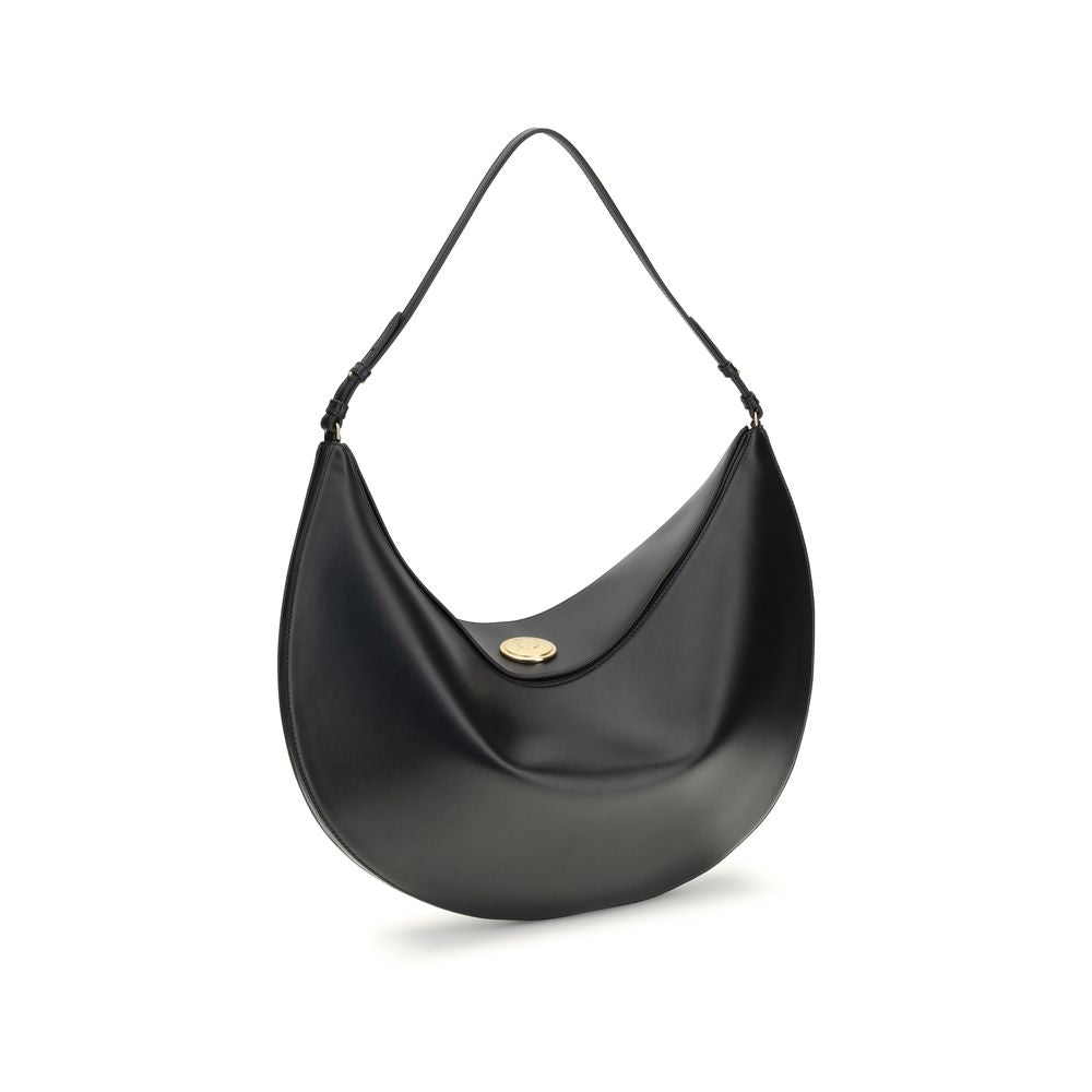 Black Calf Leather Bos Taurus Shoulder BagThe Ovalo Bag by Jacquemus is an elegant large hobo bag crafted from smooth leather, featuring a slim shoulder strap for easy carrying. The flap with a large engraved snap button ensures secure closure, while the