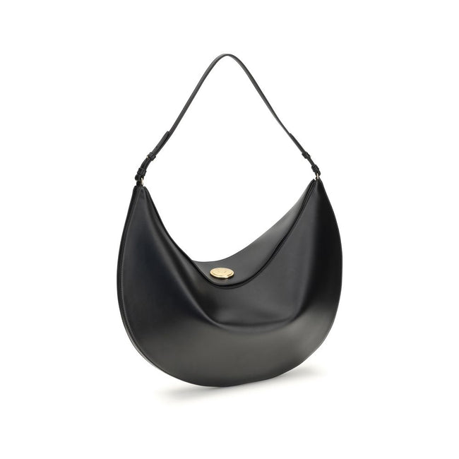 Black Calf Leather Bos Taurus Shoulder BagThe Ovalo Bag by Jacquemus is an elegant large hobo bag crafted from smooth leather, featuring a slim shoulder strap for easy carrying. The flap with a large engraved snap button ensures secure closure, while the