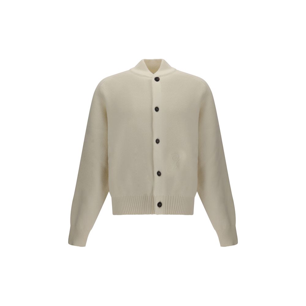 White Fleece Wool CardiganThe Virgin Wool Cardigan by Jacquemus combines elegance and comfort, featuring front buttons that emphasize its refined silhouette. The long sleeves and ribbed trims add a touch of classic style, while the embroidered detail on t