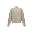 White Fleece Wool CardiganThe Virgin Wool Cardigan by Jacquemus combines elegance and comfort, featuring front buttons that emphasize its refined silhouette. The long sleeves and ribbed trims add a touch of classic style, while the embroidered detail on t