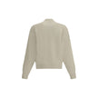 White Fleece Wool CardiganThe Virgin Wool Cardigan by Jacquemus combines elegance and comfort, featuring front buttons that emphasize its refined silhouette. The long sleeves and ribbed trims add a touch of classic style, while the embroidered detail on t