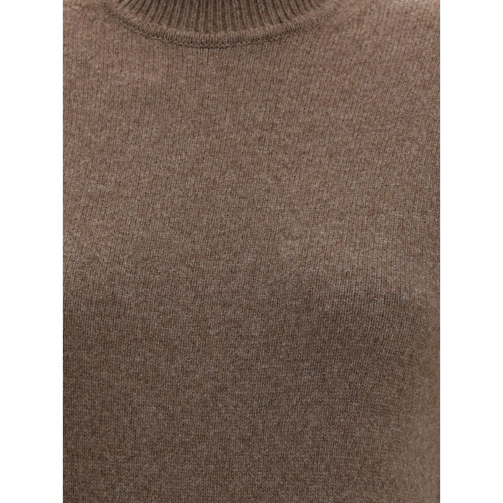 Brown Merino Wool Casual DressThe Jaquemus knit dress features structured shoulders, a high neckline, and short sleeves. With a fitted design, it combines elegance with contemporary character, perfect for a bold and refined look Season: AW25 Fit: Slim Com