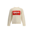 Cream Wool SweatshirtThe Kenzo x Futura 2000 sweater celebrates the collaboration between the Maison and the New York-based artist. Crafted from white wool knit, it features a crew neck, Kenzo Paris by Futura 2000 logo on the chest, and Futura 2025 signat