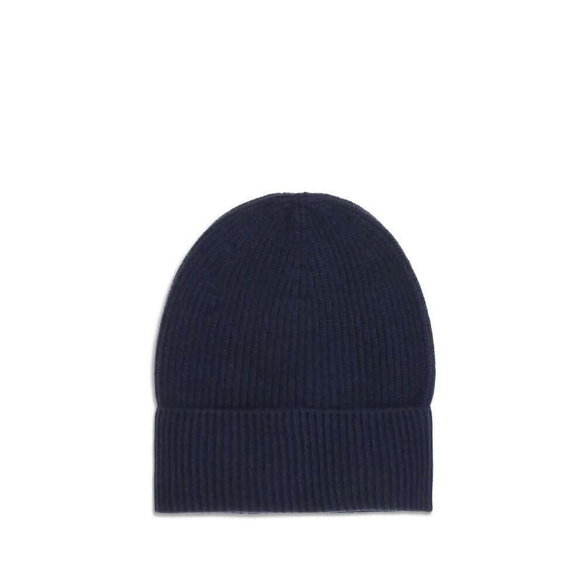 Blue Wool BeanieThe Moncler wool and cashmere hat is crafted from a soft blend of blue virgin wool and cashmere, using Italian craftsmanship. One size fits all, it guarantees warmth, comfort, and a touch of elegance. Season: AW25 Composition: 70% Wool 30%