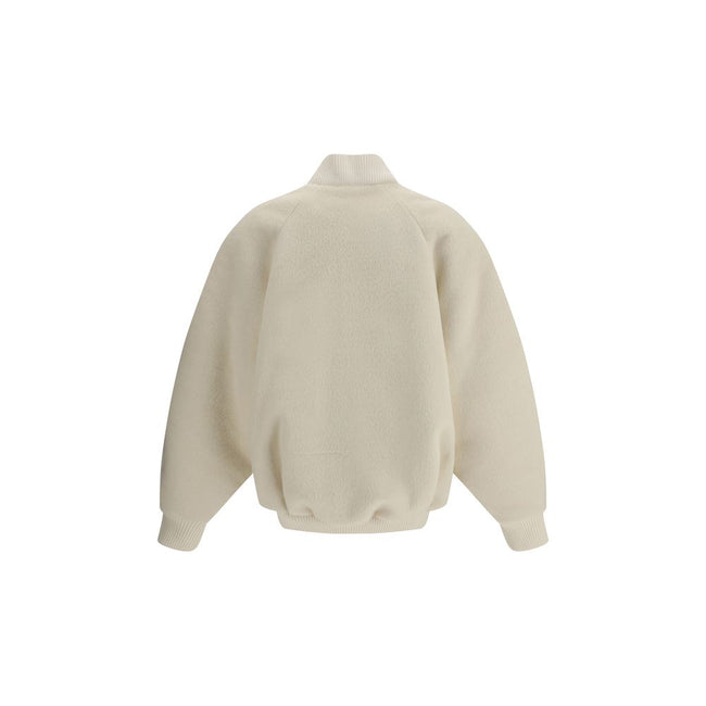 White Wool BomberThe Jacquemus Le Blouson Pilu jacket in white alpaca wool features a round neckline, front zip closure, and raglan long sleeves. Finished with ribbed wool edges, it combines comfort and sophisticated design in a contemporary piece Season: