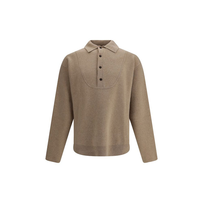 Sweater in merino WoolThe Wool Blend Sweater by Jacquemus reinterprets wardrobe codes with a poetic and contemporary touch. Featuring a pointed collar and a button fastening with a subtle retro flair, this piece combines comfort and character in a careful