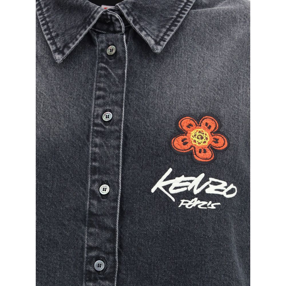 Black Denim ShirtThe Kenzo x Futura 2000 Japanese stone bleach wash denim shirt features a classic collar, single-breasted closure, button cuffs, and Futura 2000 Boke Flower embroidery on the chest, complemented by a logo label on the back. Season: AW25 F