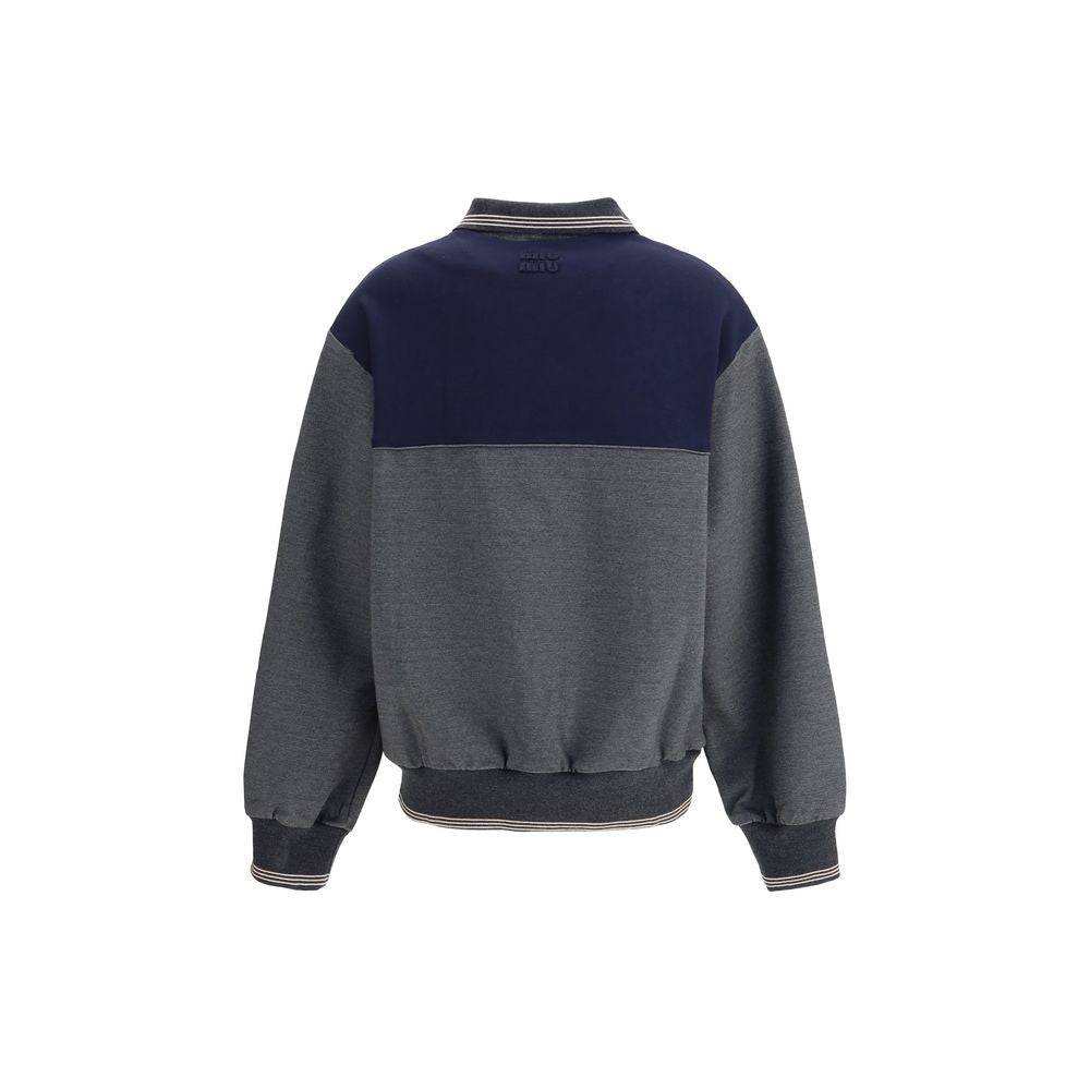 Zip polo SweatshirtZip polo Sweatshirt by Miu Miu features a loose, comfortable fit perfect for a casual, modern look. It features long sleeves with knit cuffs, a polo neck and a front zipper closure. Side pockets, a straight hem with knit trim and an emb