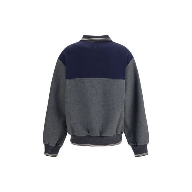 Zip polo SweatshirtZip polo Sweatshirt by Miu Miu features a loose, comfortable fit perfect for a casual, modern look. It features long sleeves with knit cuffs, a polo neck and a front zipper closure. Side pockets, a straight hem with knit trim and an emb