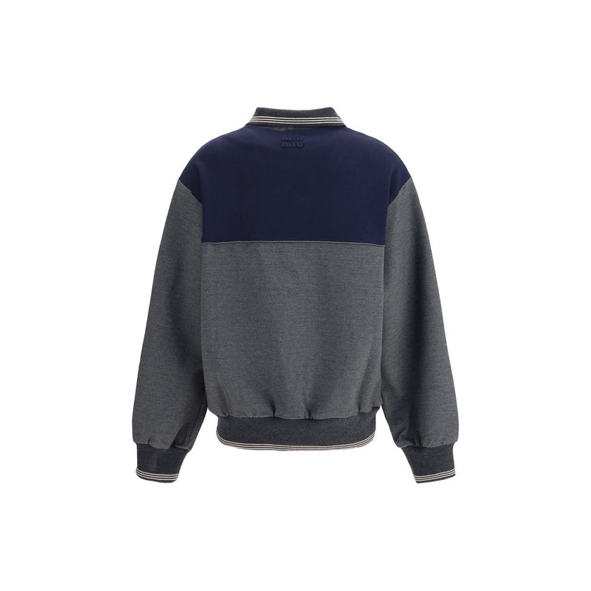 Zip polo SweatshirtZip polo Sweatshirt by Miu Miu features a loose, comfortable fit perfect for a casual, modern look. It features long sleeves with knit cuffs, a polo neck and a front zipper closure. Side pockets, a straight hem with knit trim and an emb