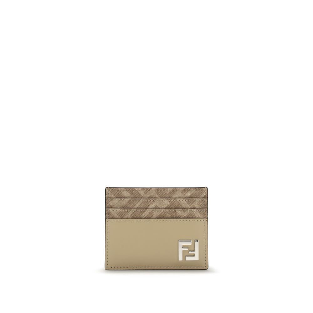 Beige Calf Leather Bos Taurus WalletThe Squared Card Holder by Fendi is a compact and elegant accessory, featuring six card slots and a central flat pocket. Crafted in beige leather, it is enriched with tone-on-tone FF canvas details and finished with a m