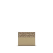 Beige Calf Leather Bos Taurus WalletThe Squared Card Holder by Fendi is a compact and elegant accessory, featuring six card slots and a central flat pocket. Crafted in beige leather, it is enriched with tone-on-tone FF canvas details and finished with a m