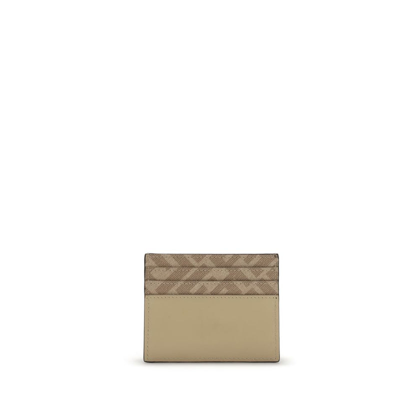 Beige Calf Leather Bos Taurus WalletThe Squared Card Holder by Fendi is a compact and elegant accessory, featuring six card slots and a central flat pocket. Crafted in beige leather, it is enriched with tone-on-tone FF canvas details and finished with a m