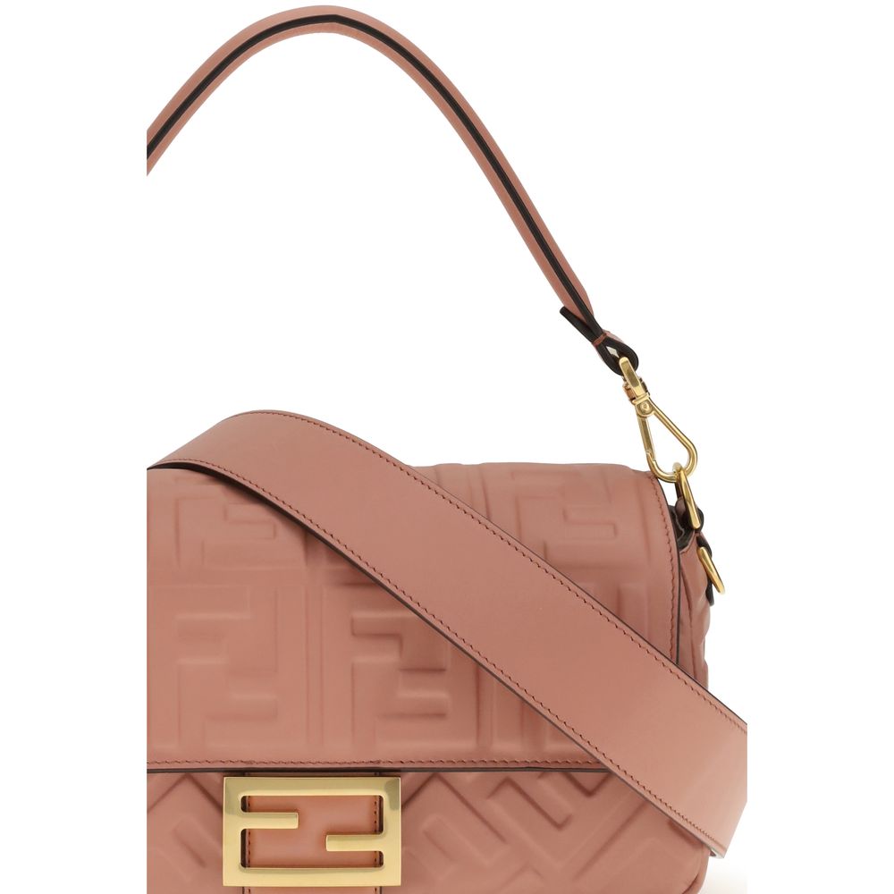 Multicolor Calf Leather Bos Taurus Shoulder BagThe Fendi Baguette Bag is crafted from pink calfskin leather with an embossed FF motif. It features a flap with magnetic closure and FF logo, a tone-on-tone nappa leather-lined interior with zip pocket, and v