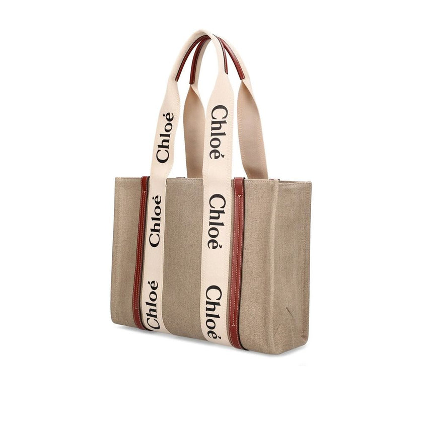 Beige Linen Tote BagDescription: – Composition: 100% Linen – Leather detail – Lenght 37 cm – Double shoulder strap – Internal flat pocket – Height: 26 cm – 1 spacious main compartment – Made in Italy – Gender: WOMEN –Beige Linen Tote Bag${tagsChloéAulae B