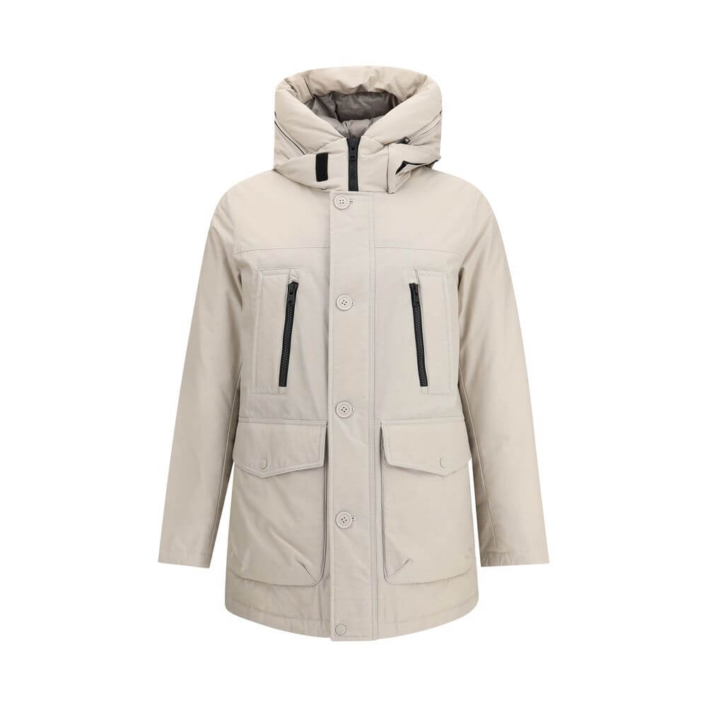 Beige Cotton ParkaCotton Ramar Down Jacket by Woolrich, high-necked model with hood, front zipper and button closure, elastic ribbed cuffs, two slit pockets with zipper applied on the front, monochrome padded design, removable patch with iconic brand mono