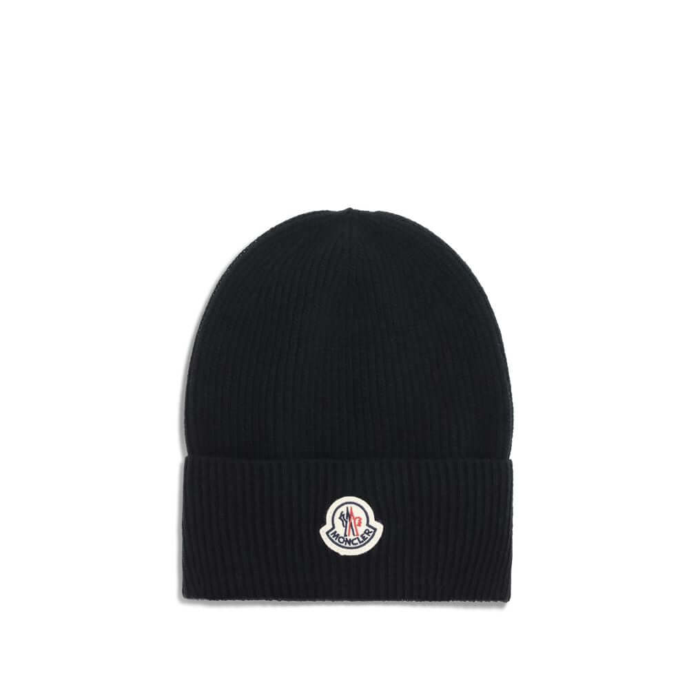 Wool and cashmere HatThe Moncler wool and cashmere hat is crafted from a soft blend of blue virgin wool and cashmere, using Italian craftsmanship. One size fits all, it guarantees warmth, comfort, and a touch of elegance. Season: AW25 Composition: GENERAL