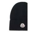 Wool and cashmere HatThe Moncler wool and cashmere hat is crafted from a soft blend of blue virgin wool and cashmere, using Italian craftsmanship. One size fits all, it guarantees warmth, comfort, and a touch of elegance. Season: AW25 Composition: GENERAL