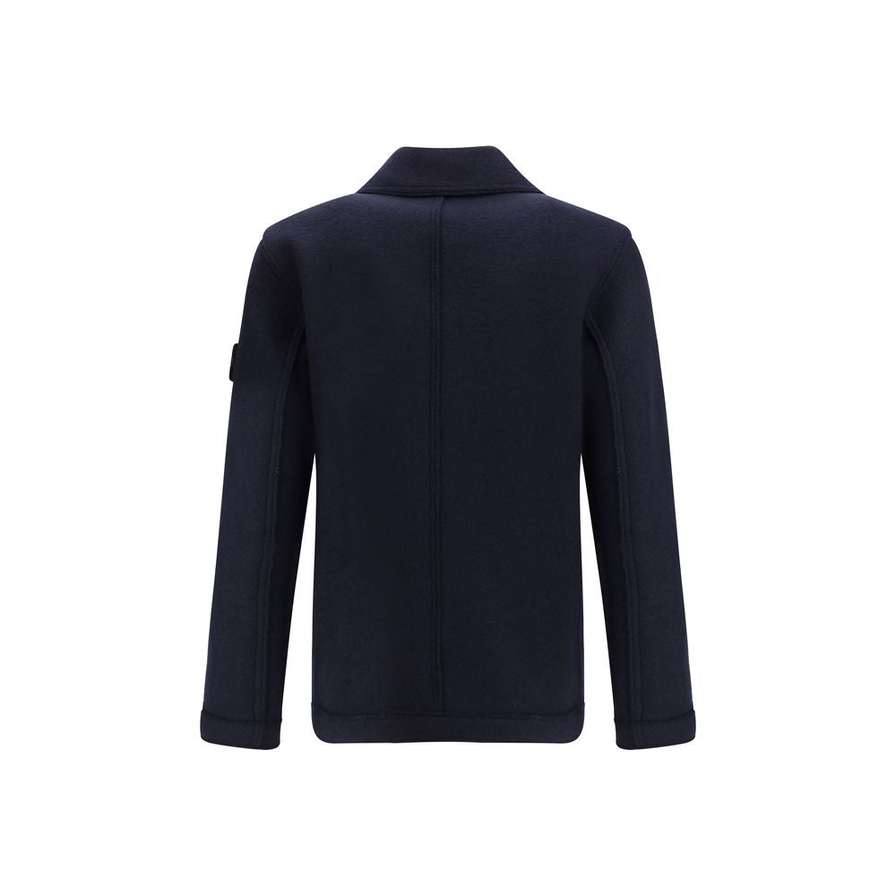 Blue Fleece Wool CoatThe Wool felt Coat by Stone Island features an oversized fit and functional design. Featuring chest patch pockets and a snap-button closure, it is complemented by the distinctive Stone Island badge on the left sleeve, a symbol of qual
