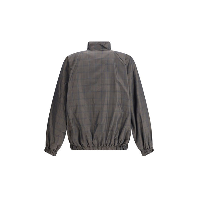 Brown Cotton Shell JacketThis Balenciaga Jacket is crafted from checked Cotton and Linen, featuring a high collar and a double-slider zip closure. With long sleeves, two slash pockets, and a drawstring waist, it is finished with embroidered Balenciaga log