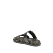 FF fabric sandalThe FF fabric Sandal by Fendi is a flat slide featuring a double strap with a decorative FF Baguette buckle. Crafted in jacquard fabric with the iconic FF pattern and black nappa leather details, it is finished with gold-tone metal hardwar