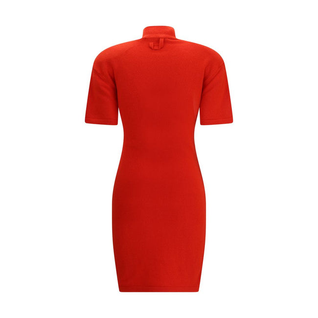 Red Merino Wool Casual DressThe Jaquemus knit dress features structured shoulders, a high neckline, and short sleeves. With a fitted design, it combines elegance with contemporary character, perfect for a bold and refined look Season: AW25 Fit: Slim Compo