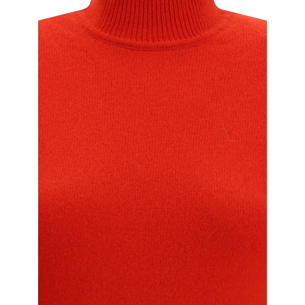 Red Merino Wool Casual DressThe Jaquemus knit dress features structured shoulders, a high neckline, and short sleeves. With a fitted design, it combines elegance with contemporary character, perfect for a bold and refined look Season: AW25 Fit: Slim Compo