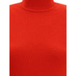 Red Merino Wool Casual DressThe Jaquemus knit dress features structured shoulders, a high neckline, and short sleeves. With a fitted design, it combines elegance with contemporary character, perfect for a bold and refined look Season: AW25 Fit: Slim Compo