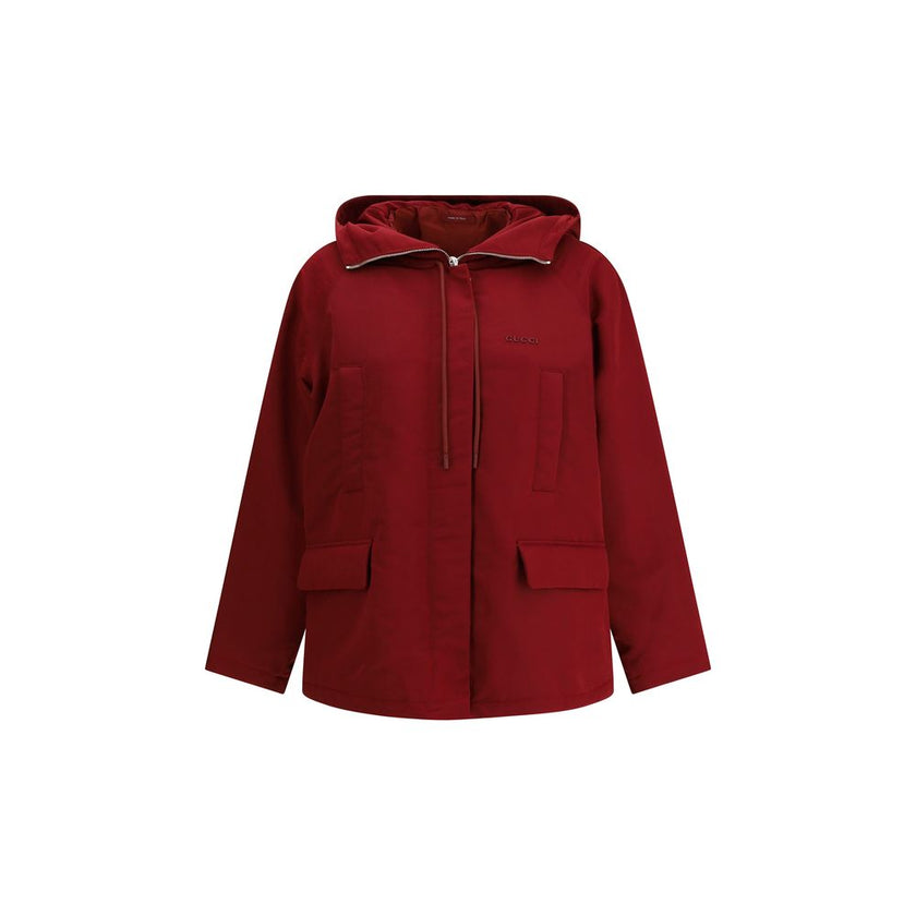 Bordeaux Polyester Shell JacketThe Gucci Red Polyester faille Jacket combines functionality with contemporary style. Featuring a fixed hood with zip and drawcord, four front pockets, adjustable elastic hem, and padding, it provides comfort and protection.