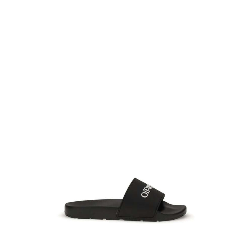 Black Polyethylene SandalsThe Slides by Off-White are a casual and distinctive accessory, designed for an urban and contemporary style. They feature a minimalist silhouette with a wide, comfortable strap, highlighted by the contrasting white Off-White log