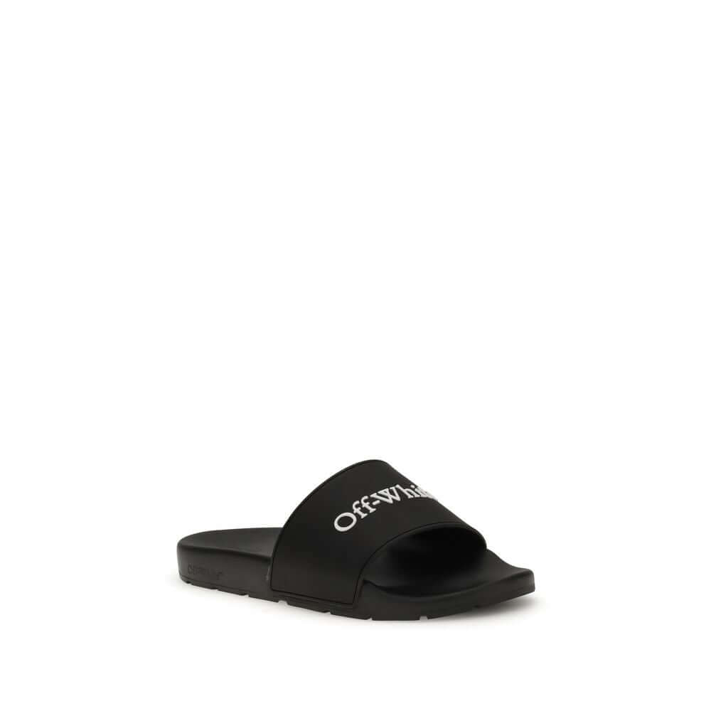 Black Polyethylene SandalsThe Slides by Off-White are a casual and distinctive accessory, designed for an urban and contemporary style. They feature a minimalist silhouette with a wide, comfortable strap, highlighted by the contrasting white Off-White log