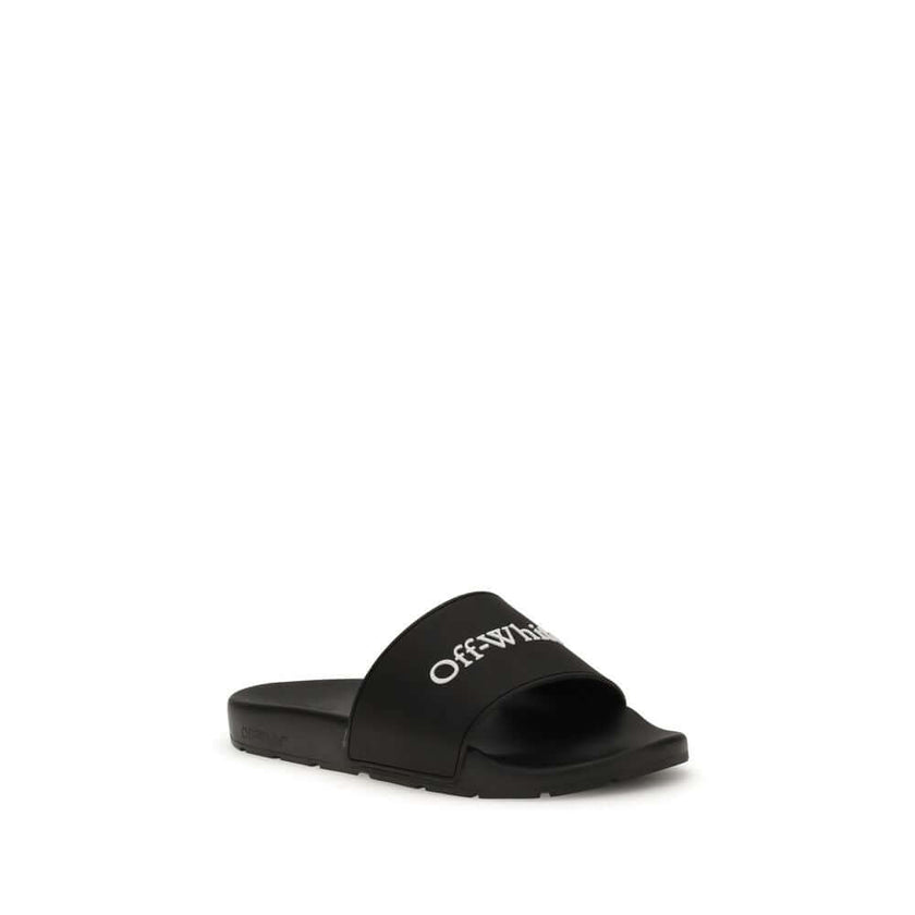 Black Polyethylene SandalsThe Slides by Off-White are a casual and distinctive accessory, designed for an urban and contemporary style. They feature a minimalist silhouette with a wide, comfortable strap, highlighted by the contrasting white Off-White log