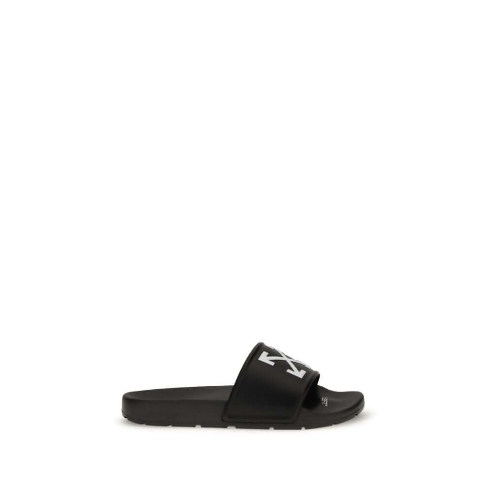 Black Polyethylene SandalsThe Arrow Slides by Off-White are a casual and distinctive accessory, designed for an urban and contemporary style. They feature a clean silhouette with a wide, comfortable strap, highlighted by the brand’s contrasting white embl