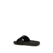 Black Polyethylene SandalsThe Arrow Slides by Off-White are a casual and distinctive accessory, designed for an urban and contemporary style. They feature a clean silhouette with a wide, comfortable strap, highlighted by the brand’s contrasting white embl