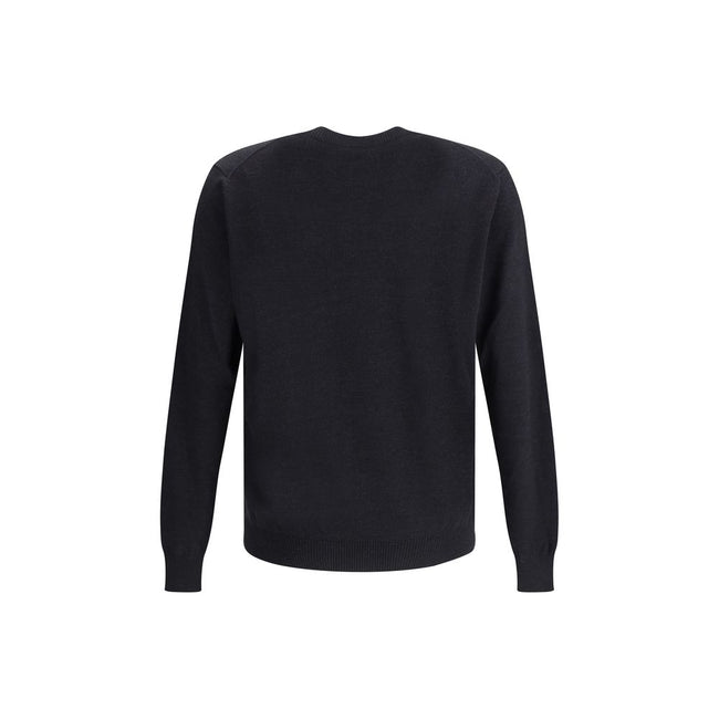 Wool SweaterFendi’s Wool Sweater is a classic and refined piece, crafted with ribbed detailing on the crew neck, hem and cuffs for a comfortable and curated fit. The brand’s iconic logo, stitched tone-on-tone on the front, adds an understated touch of ele