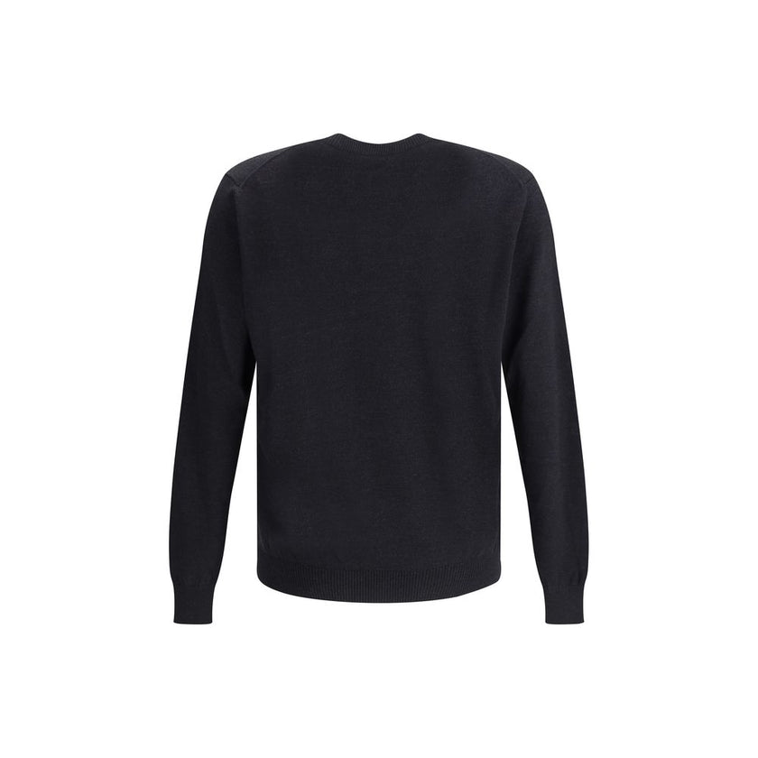 Wool SweaterFendi’s Wool Sweater is a classic and refined piece, crafted with ribbed detailing on the crew neck, hem and cuffs for a comfortable and curated fit. The brand’s iconic logo, stitched tone-on-tone on the front, adds an understated touch of ele