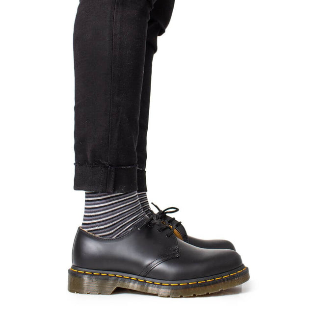 Black Leather Oxfords And DerbiesThe Dr. Martens 1461 Mono Black Smooth men’s dress shoes are a perfect blend of style and comfort. Made with a 100% leather upper, these shoes offer a sophisticated look and long-lasting durability. The inner lining is com