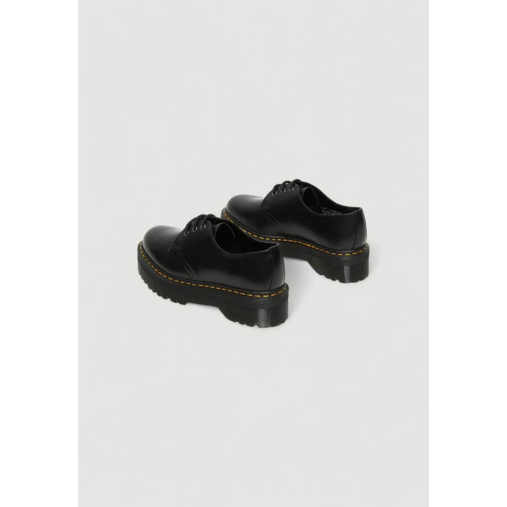 Black Leather Lace-Up BootsThe Dr. Martens 1461 QUAD 25567001 women’s lace-up shoes are a must-have for those seeking style and comfort. Made from 100% high-quality leather, these shoes offer exceptional durability and an iconic look. The classic design i